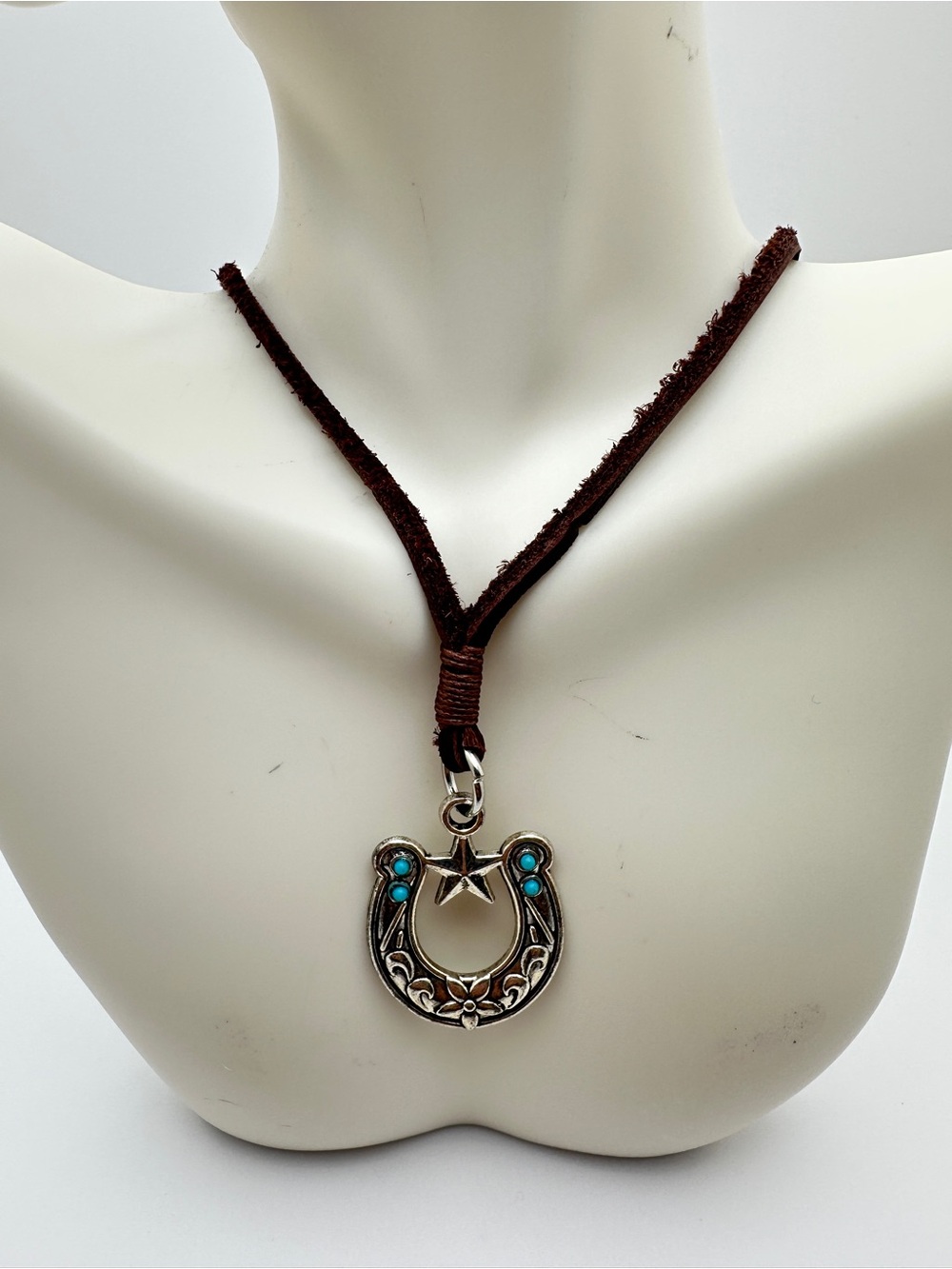 Turquoise Accent Horseshoe Necklace on Brown Suede Cord
